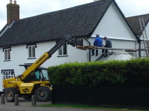 Yes, use a forklift as one support for a ladder