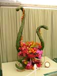 a flower-arrangement designed around snakes seen at a bazaar in India